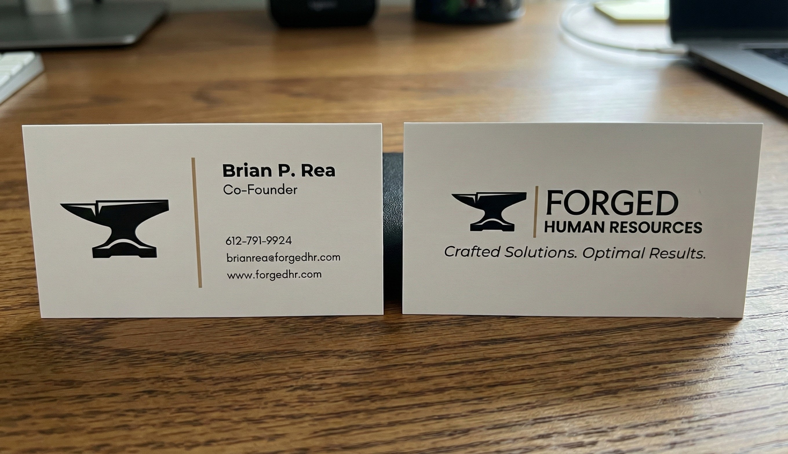 Business cards showcasing the primary brand identity.